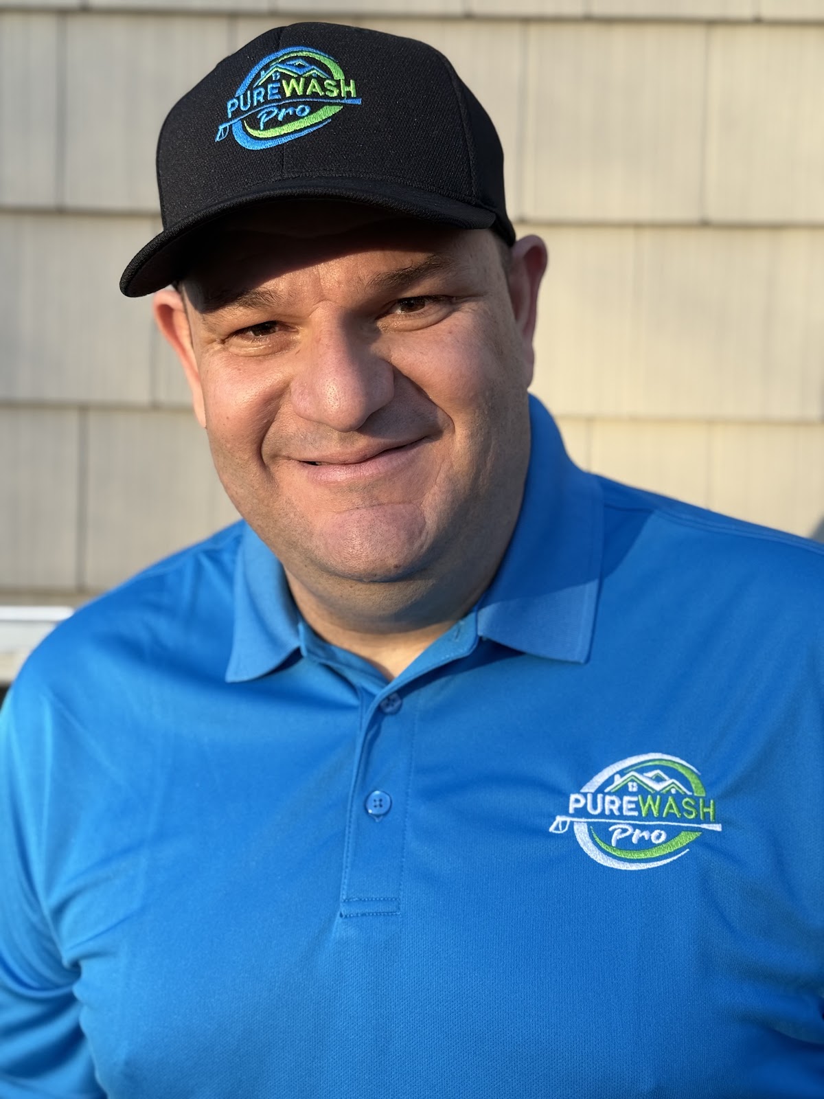 Anthony Benavides, owner of Pure Wash Pro, wearing his company uniform